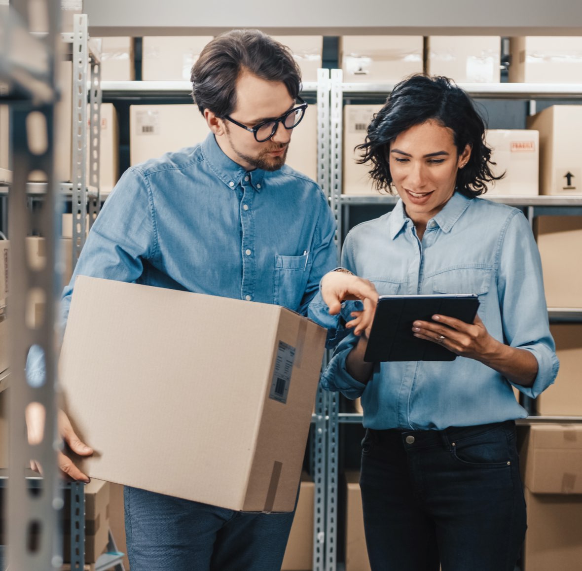 W-2 warehouse staff using a tablet to fill orders efficiently