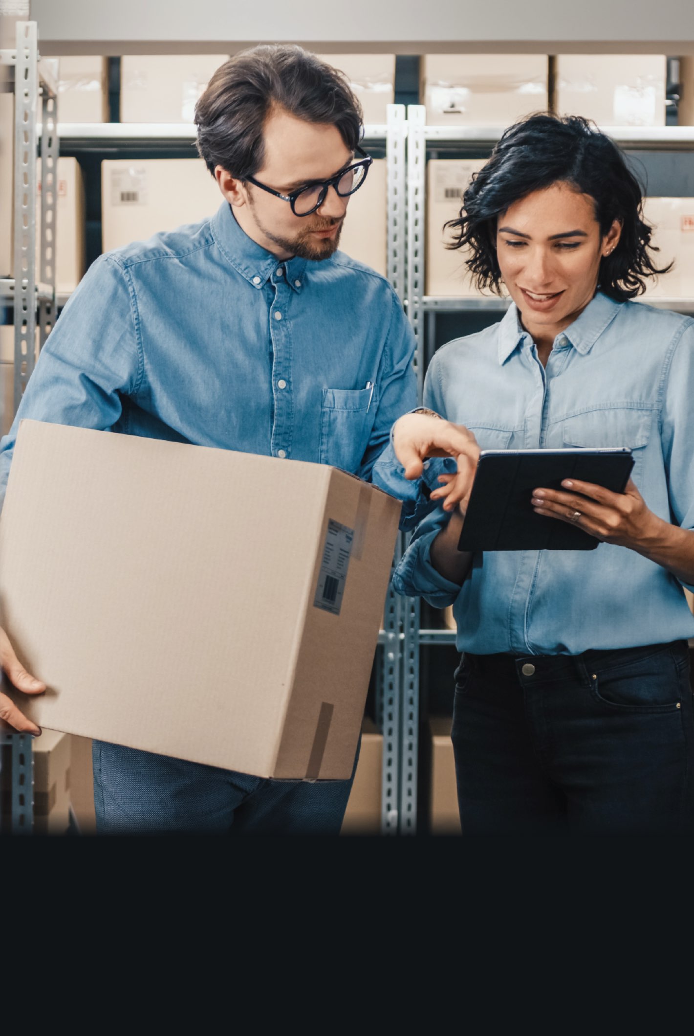 W-2 warehouse staff using a tablet to fill orders efficiently