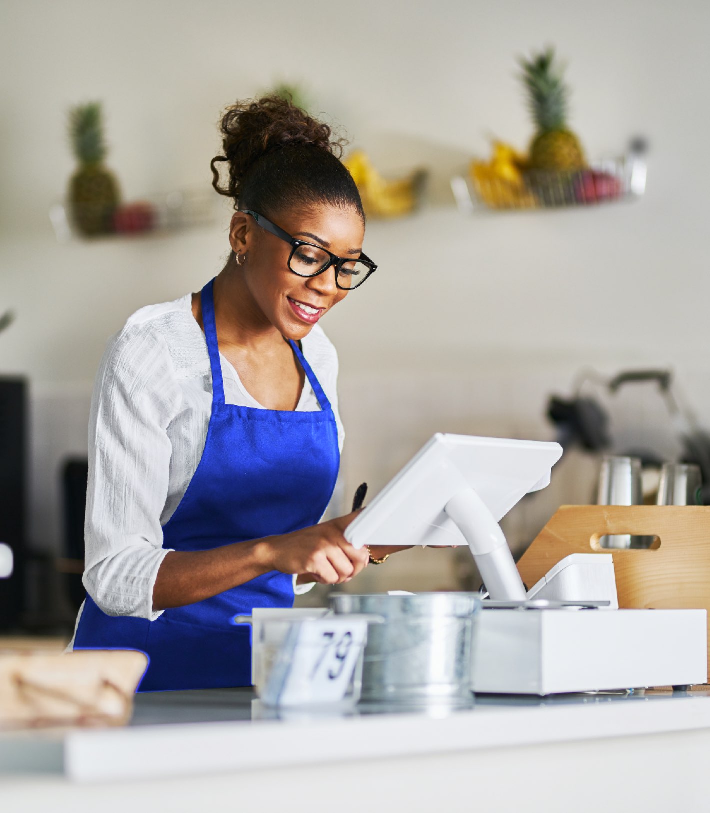 Cashier / hospitality temp worker with a positive attitude taking orders from customers